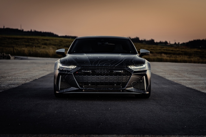 Audi RS7 with topographic wrap at sunset