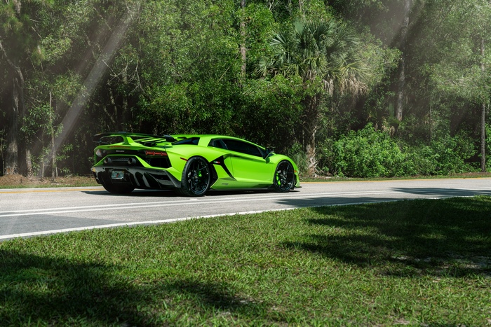 Green Lamborghini Aventador SVJ on a Road