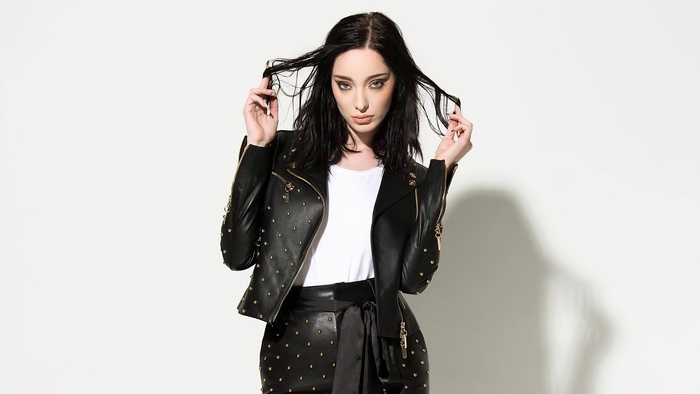 Emma Dumont in studded leather jacket