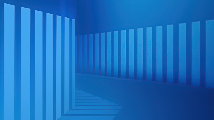 Abstract blue geometric shapes in a hallway