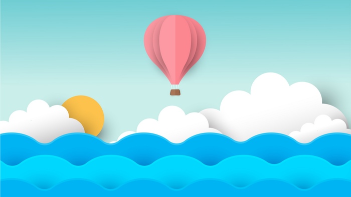 Pink hot air balloon over blue waves and clouds