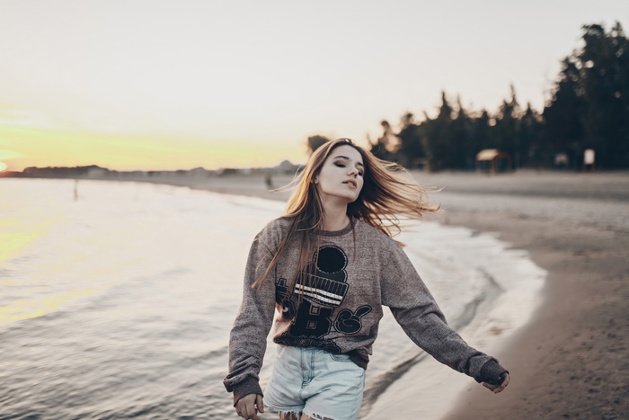 Girl on a beach at sunset