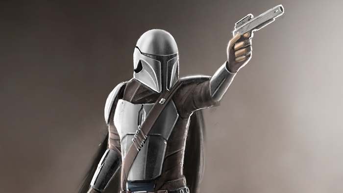 The Mandalorian holding a blaster