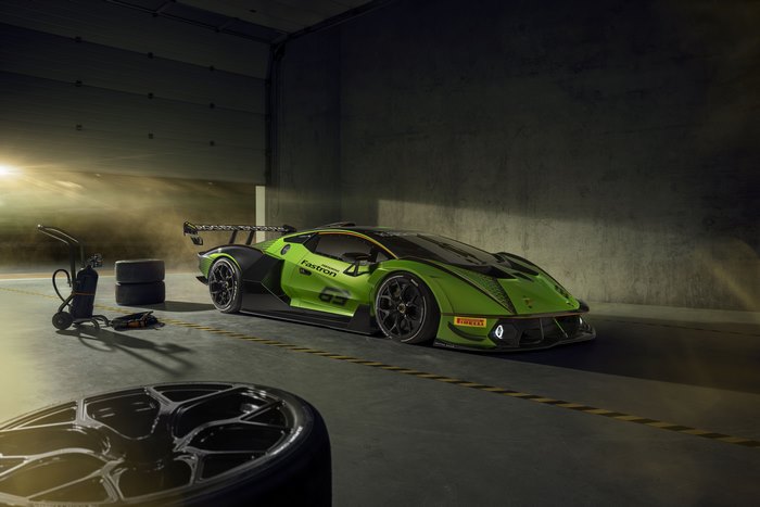 Green Lamborghini Essenza SCV12 race car in garage