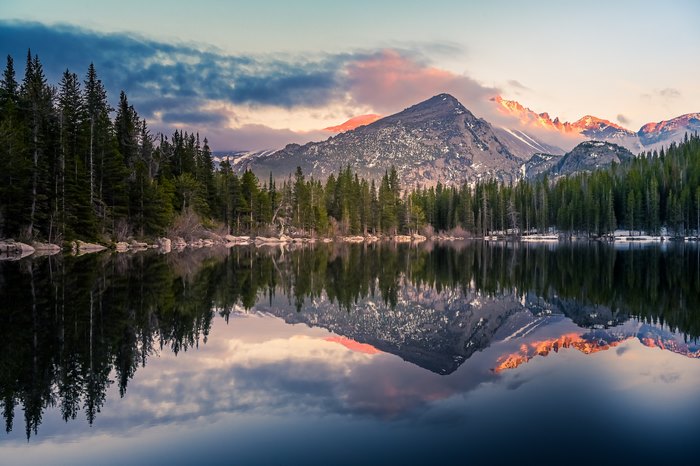 Mountain lake reflection at sunrise 4K