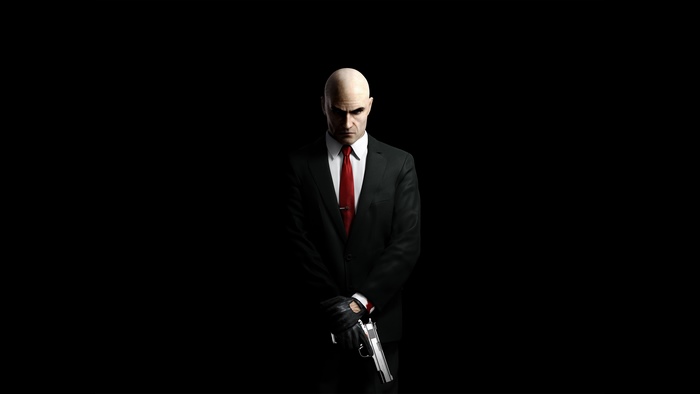 Agent 47 from Hitman holding a gun