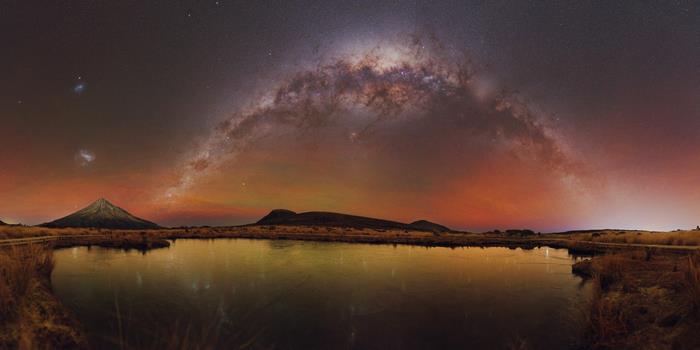 Milky Way Arching Over Mount Taranaki and Lake Rotorangi