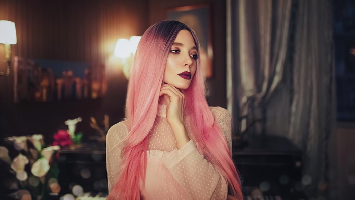 Model with pink hair and dark lipstick