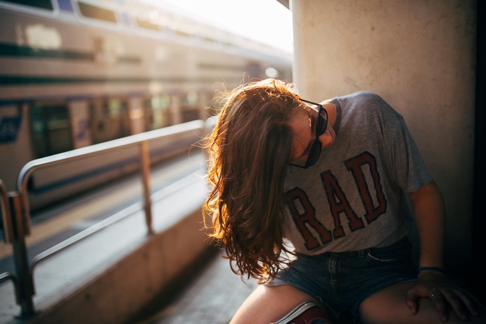 Girl with long hair wearing a t-shirt and shorts