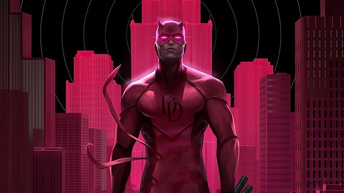 Daredevil in a red suit in front of a city skyline