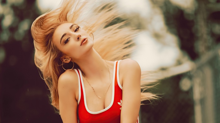 Blonde model in red Adidas swimsuit