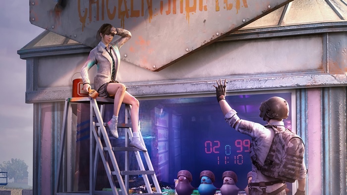 Woman painting sign with man waving