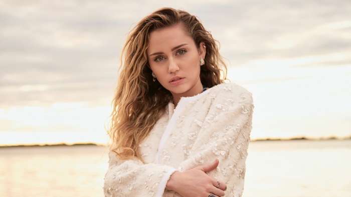 Miley Cyrus in a white jacket