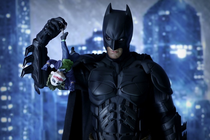 Batman holding Joker figure