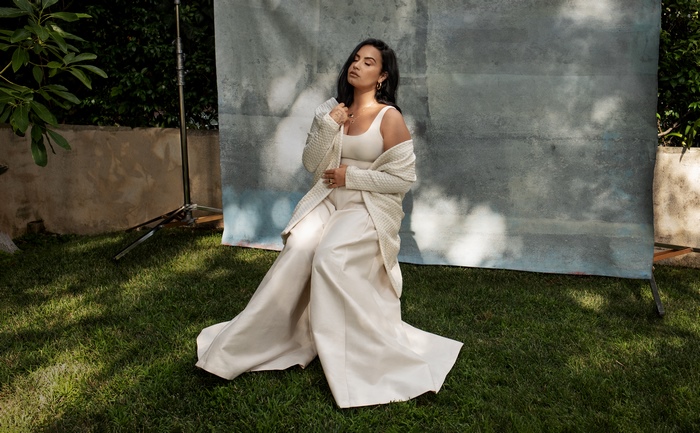 Demi Lovato sitting outdoors