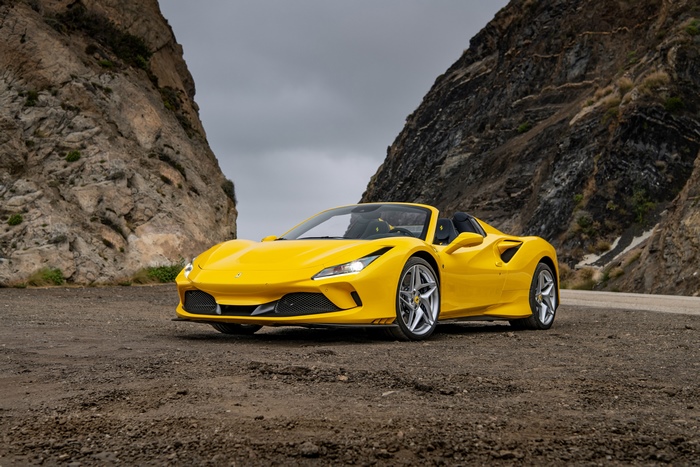 Yellow Ferrari F8 Tributo Convertible on a Dirt Road