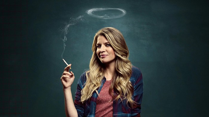 Woman smoking a cigarette with a smoke ring