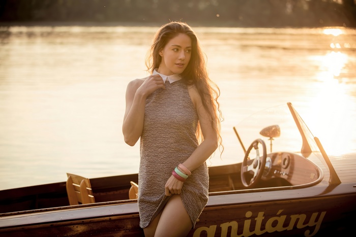 Model in a dress on a boat