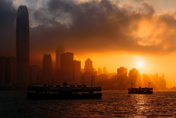 Hong Kong Skyline at Sunset with Ferries