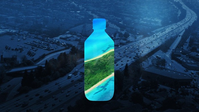 Bottle with tropical island landscape over highway