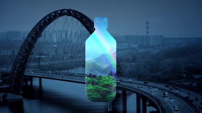 Bottle with Landscape and Rainbow over Cityscape and Bridge