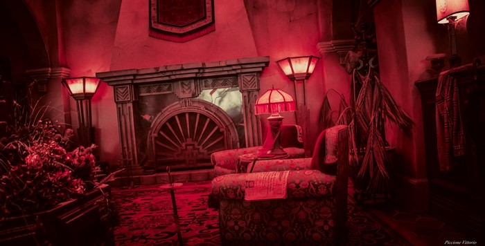Interior of a dimly lit room with red lighting