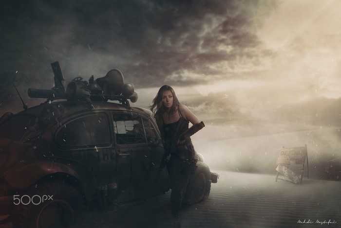 Woman with modified car in apocalyptic desert