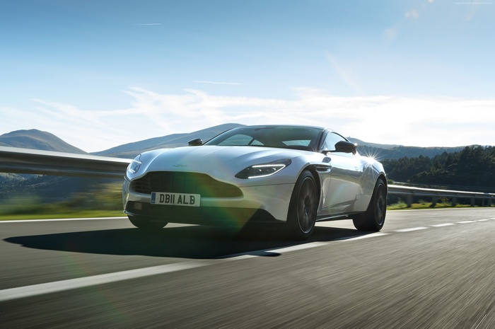 Aston Martin DB11 V8 on a sunny road