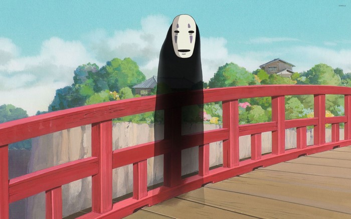 No-Face from Spirited Away on a bridge