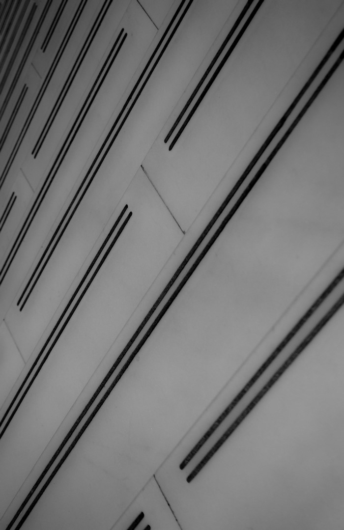 Monochrome abstract pattern of parallel lines on a white surface