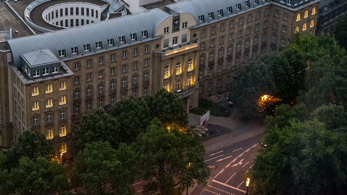 Building in Frankfurt at Dusk with Trees and Street