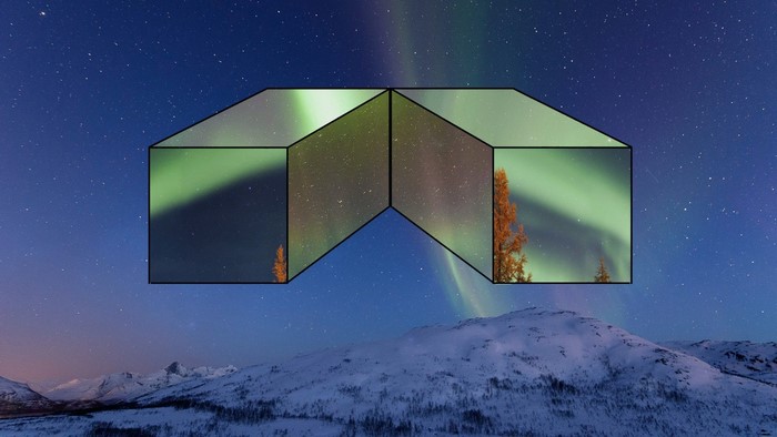 Aurora Borealis over snowy mountains