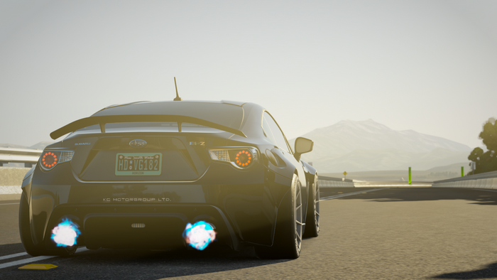 Subaru BRZ sports car with blue exhaust flames on a road