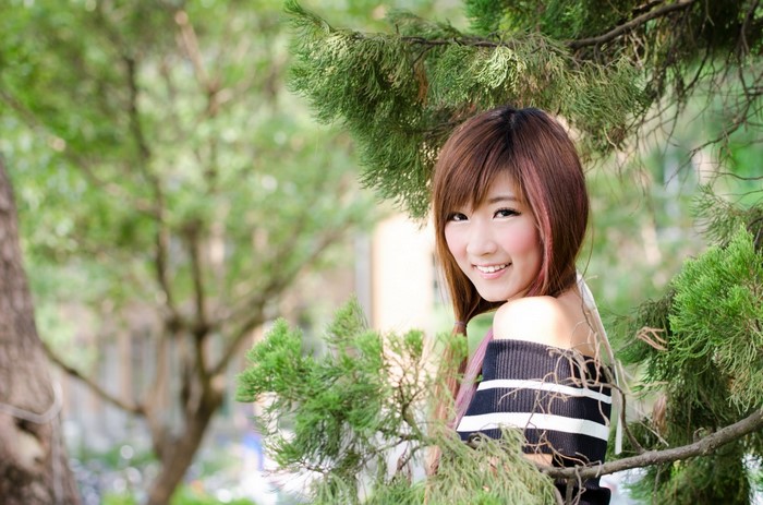 Young Asian woman with dyed hair in a forest