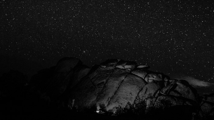 Night sky over rocky landscape with stars