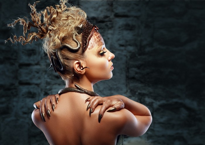 Woman with snakes in hair and on neck