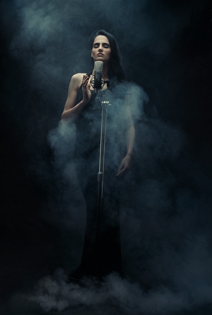 Singer in smoke with microphone