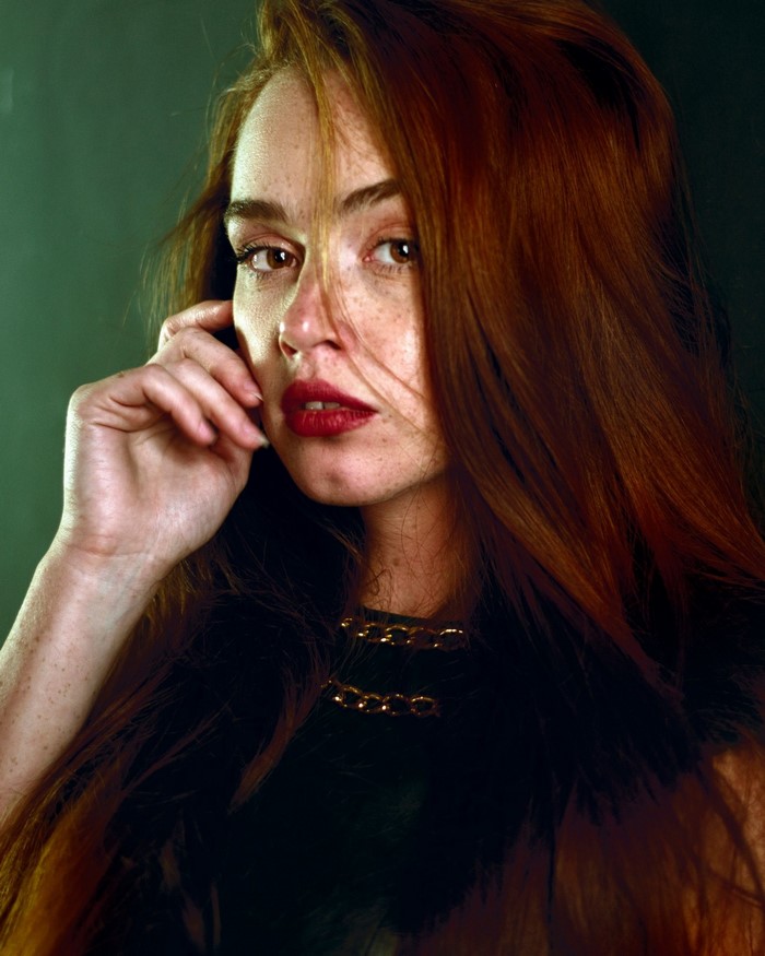 Woman with red hair and red lipstick, portrait