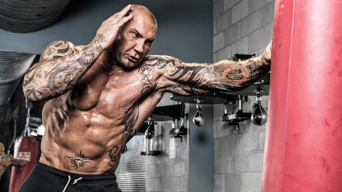 Dave Bautista training with a punching bag