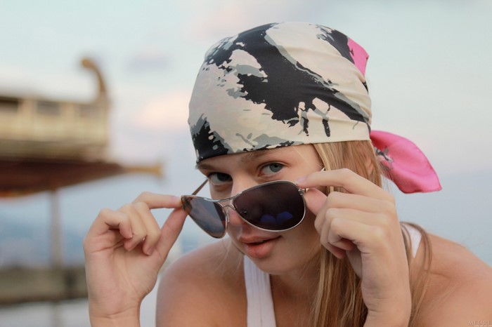 Girl Wearing Sunglasses and Colorful Headscarf
