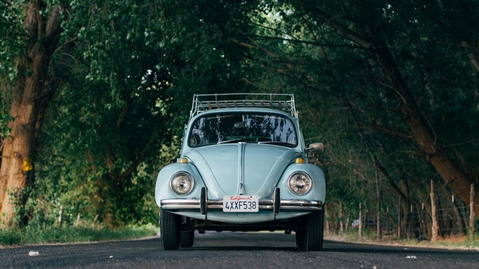 Light blue Volkswagen Beetle with California license plate