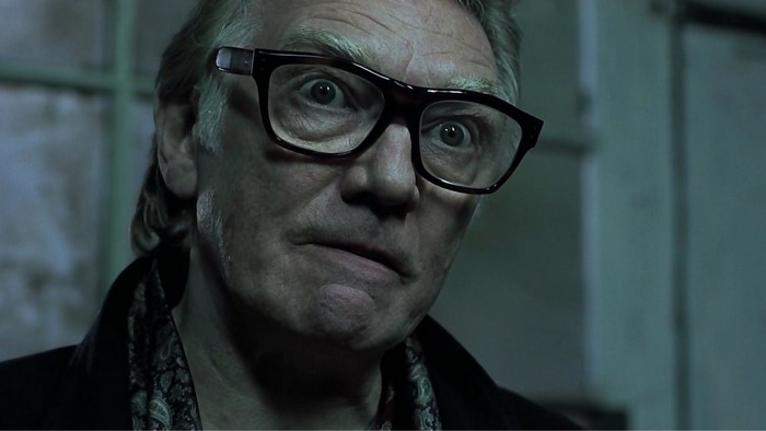 Brick from Snatch wearing glasses