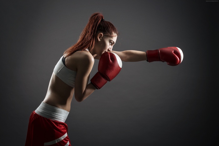 Girl in boxing gloves and shorts