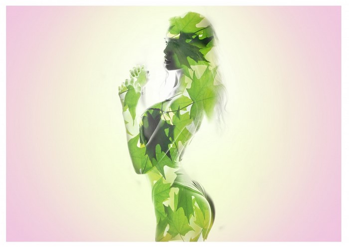 Double exposure of woman and green leaves