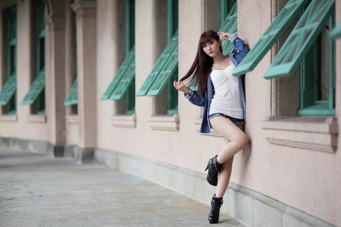 Fashionable Woman in Blue Denim Jacket Posing Outdoors