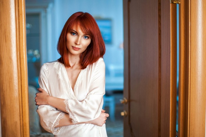 Portrait of a Redhead Woman with Blue Eyes