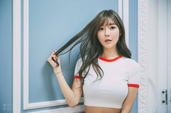 Portrait of Woman with Long Brunette Hair in Crop Top