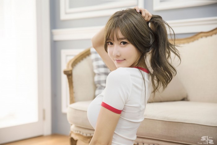 Choi Seul Gi Smiling Indoors with Long Brown Hair