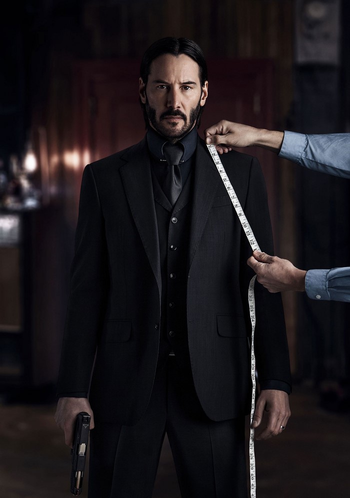 John Wick from John Wick Chapter 2 being measured for a suit