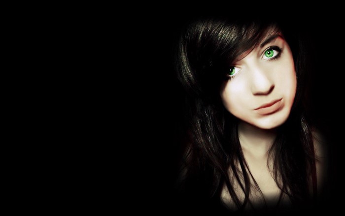 Woman with green eyes and black hair